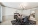 Formal dining room with elegant decor, a stylish rug, and a view of the modern kitchen at 989 Vendue Dr, Lawrenceville, GA 30044