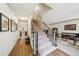 Bright foyer with hardwood floors, staircase with black iron railing, and views into the living areas at 989 Vendue Dr, Lawrenceville, GA 30044