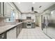 Updated kitchen with stainless steel appliances, granite countertops, and ample cabinet space at 989 Vendue Dr, Lawrenceville, GA 30044