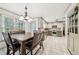 Updated eat-in kitchen with stainless steel appliances and a door leading to the outdoor patio at 989 Vendue Dr, Lawrenceville, GA 30044