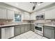 Updated kitchen featuring stainless steel appliances, granite countertops, and tile backsplash at 989 Vendue Dr, Lawrenceville, GA 30044