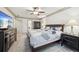Spacious main bedroom with king bed, ceiling fan, and neutral decor at 989 Vendue Dr, Lawrenceville, GA 30044