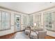 Sitting area with two armchairs, a small rug, and view of outdoor patio at 989 Vendue Dr, Lawrenceville, GA 30044