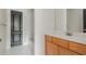 Bathroom with vanity and tiled floor, next to a closet with a black door at 2430 Dresden Parc Cir, Atlanta, GA 30345