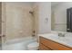 Neutral bathroom featuring tiled shower-tub combo, vanity with sink, and modern fixtures at 2430 Dresden Parc Cir, Atlanta, GA 30345