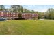 Complex exterior with lush green lawn and trees at 2430 Dresden Parc Cir, Atlanta, GA 30345