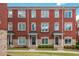 Brick townhome featuring classic architecture with individual entrances and well-maintained landscaping at 2430 Dresden Parc Cir, Atlanta, GA 30345