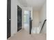 Upstairs hallway with carpeted floors, access to bedrooms, and staircase to lower level at 2430 Dresden Parc Cir, Atlanta, GA 30345