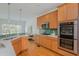Bright kitchen features stainless appliances, white counters, hardwood floors and plenty of natural light at 2430 Dresden Parc Cir, Atlanta, GA 30345