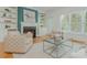 Cozy living room with fireplace, built-in shelving, and plush seating for relaxation at 2430 Dresden Parc Cir, Atlanta, GA 30345