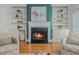 Inviting living room with fireplace, built-in shelving, and comfortable seating arrangement at 2430 Dresden Parc Cir, Atlanta, GA 30345