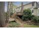 The home's wooden deck connects to the lush backyard through a series of wooden stairs at 2962 Moorings Pkwy, Snellville, GA 30039