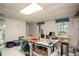 Finished basement with natural light offers ample workspace and storage at 2962 Moorings Pkwy, Snellville, GA 30039