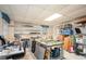 Large basement area with white shelving and tables providing ample space for storage at 2962 Moorings Pkwy, Snellville, GA 30039