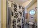 Bathroom featuring a shower-tub combination and octagonal window at 2962 Moorings Pkwy, Snellville, GA 30039