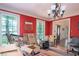Sunlit red dining room with large windows offering natural light and scenic views at 2962 Moorings Pkwy, Snellville, GA 30039