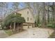 Side view of home featuring a two-car garage and lush greenery at 2962 Moorings Pkwy, Snellville, GA 30039
