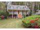 Classic two-story home with a spacious front porch perfect for relaxing at 2962 Moorings Pkwy, Snellville, GA 30039