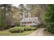 Inviting two-story home surrounded by mature trees and colorful azaleas at 2962 Moorings Pkwy, Snellville, GA 30039