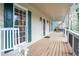 Inviting front porch with rocking chairs and a view of the lush surroundings at 2962 Moorings Pkwy, Snellville, GA 30039