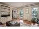 Bright living room with built-in shelving and large windows overlooking the outdoors at 2962 Moorings Pkwy, Snellville, GA 30039