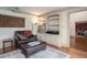 Comfortable living room with a leather chair, built-in shelves, and a projector for relaxing entertainment at 2962 Moorings Pkwy, Snellville, GA 30039