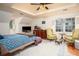 Spacious main bedroom with a tray ceiling, two sitting chairs, and hardwood floors at 2962 Moorings Pkwy, Snellville, GA 30039