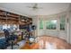 Well-lit office with large windows, built-in shelves, and hardwood floors at 2962 Moorings Pkwy, Snellville, GA 30039