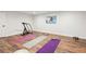 Finished basement area with workout equipment and hardwood style floors at 4152 Club Ne Dr, Atlanta, GA 30319