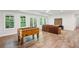 Finished basement area with foosball table, leather couch, and natural light at 4152 Club Ne Dr, Atlanta, GA 30319