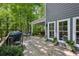 Relaxing deck featuring a grill, dining set, and outdoor seating area overlooking a lush backyard at 4152 Club Ne Dr, Atlanta, GA 30319