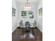 Cozy dining room has a glass table, views of the yard, and is beautifully decorated with art at 4152 Club Ne Dr, Atlanta, GA 30319