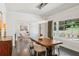 Elegant dining room featuring hardwood floors, natural light, and stylish pendant lighting at 4152 Club Ne Dr, Atlanta, GA 30319