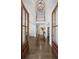 Grand two-story foyer with hardwood floors, high ceilings, and elegant double doors at 4152 Club Ne Dr, Atlanta, GA 30319