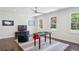Spacious game room with pool table, TV, and natural light from multiple windows at 4152 Club Ne Dr, Atlanta, GA 30319