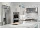 Up close is the luxury kitchen with stainless steel appliances and a stylish marble backsplash at 4152 Club Ne Dr, Atlanta, GA 30319