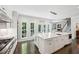 Spacious kitchen features a large island with seating and leads to the stairs and living area at 4152 Club Ne Dr, Atlanta, GA 30319