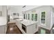 Open kitchen boasts a large island with seating and doors leading to the outside at 4152 Club Ne Dr, Atlanta, GA 30319