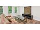 Finished basement area with couch, TV, and natural light at 4152 Club Ne Dr, Atlanta, GA 30319