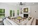 Cozy living room featuring a fireplace, built-in bookshelves, and access to the outdoor space at 4152 Club Ne Dr, Atlanta, GA 30319