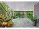 Back patio with stone pavers, plants, and a seating area with a view of the fenced backyard at 4152 Club Ne Dr, Atlanta, GA 30319