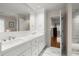 This bathroom features double sinks, a large mirror, and access to a shower, creating a functional and stylish space at 5515 Cross Gate Ct, Sandy Springs, GA 30327