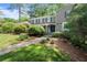 Traditional home with manicured lawn, stone accents, and lush landscaping for a classic look at 5515 Cross Gate Ct, Sandy Springs, GA 30327