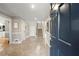 Welcoming foyer with tiled flooring, staircase, and view of the kitchen at 5515 Cross Gate Ct, Sandy Springs, GA 30327