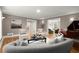 Spacious living room with hardwood floors, elegant seating, and ample natural light at 5515 Cross Gate Ct, Sandy Springs, GA 30327
