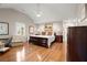 This spacious main bedroom features hardwood floors, neutral walls, and a lovely vaulted ceiling with a ceiling fan at 5515 Cross Gate Ct, Sandy Springs, GA 30327