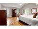 Spacious bedroom features hardwood floors, natural light, and a vaulted ceiling, creating a serene and inviting atmosphere at 5515 Cross Gate Ct, Sandy Springs, GA 30327