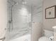 Elegant shower with marble walls, glass enclosure, and modern fixtures, providing a luxurious spa-like experience at 5515 Cross Gate Ct, Sandy Springs, GA 30327