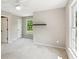 Bedroom boasts plush neutral carpet and two windows providing great natural light at 7020 Weybridge Dr, Cumming, GA 30040