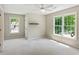 Bedroom features plush neutral carpet and natural light from two big windows on separate walls at 7020 Weybridge Dr, Cumming, GA 30040
